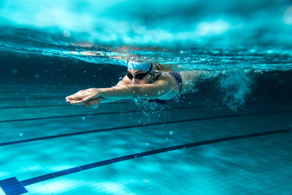 A woman swimming to get fit and lose weight.